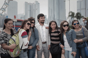 CHAMP WITH COMPATRIOTS Philippine boxing icon Manny Pacquiao poses with fans in Hong Kong. Pacquiao is touring Hong Kong ahead of his World Boxing Organization title defense against undefeated Chris Algieri of the US, to be held in Macau on November 22, 2014. AFP PHOTO