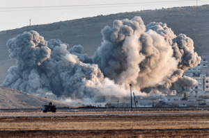 Smoke rises during airstrikes on the Syrian town of Ain al-Arab, known as Kobane by the Kurds, seen from the Turkish-Syrian border in the southeastern village of Mursitpinar, Sanliurfa province, on Thursday. AFP PHOTO