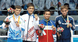 (Left to right) Kazakhstan’s Birzhan Zhakypov, gold medalist South Korea’s Shin Jong-hun and bronze medalists Philippines’ Mark Barriga and Kyrgyzstan’s Turat Osmonov stand on the podium during the victory ceremony for the men’s light flyweight (46-49kg) boxing event during the 17th Asian Games at the Seonhak Gymnasium in Incheon.  AFP PHOTO