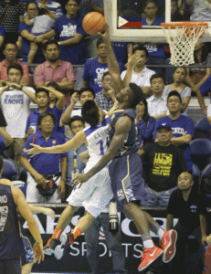 NU’s Alfred Aroga blocks a lay up attempt by Ateneo’s Kiefer Ravena. PHOTO BY RENE DILAN