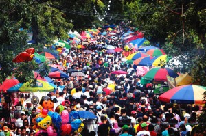 TRADITION Crowds pack the manila north cemetery as filipinos visit the graves of their loved ones to offer prayers, candles and flowers on all saints day.  Photo By Ruy Martinez 