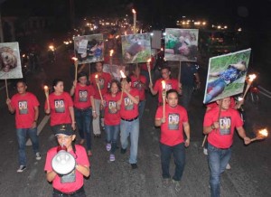 Torches of Protest Members of the National Press Club (NPC) take part in a symbolic torch parade protest from the NPC to Department of Justice office in Manila on Friday to demand justice for media representatives who died in the Ampatuan Massacre.  Photo by RUY MARTINEZ