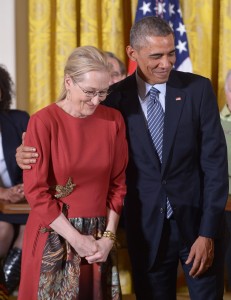 US President Barack Obama puts his arm around actress Meryl Streep as her citation is read during the Medal of Freedom presentation ceremony in the East Room of the White House on Monday. AFP Photo