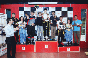 The winning teams pose at the podium as Bosch’s Paulo Duarte looks on