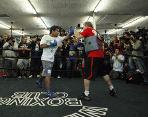 Manny Pacquiao works on the mitts with trainer Freddie Roach. AFP FILE PHOTO