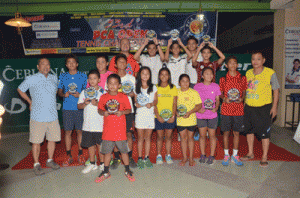 THE FUTURE OF PHILIPPINE TENNIS Cebuana Lhuillier President/CEO Jean Henri D. Lhuillier, Philippine Columbian Association (PCA) Open Organizing Committee Chairman Raul Diaz and PCA Open Tournament Director Chito Estanislao together with the age-group winners. CONTRIBUTED PHOTO