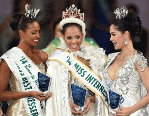 Miss Puerto Rico Valerie Hernandez Matias (C) reacts as she is congratulated by runner-up Miss Colombia Zuleika Kiara Suarez Torrenegra (L) and second runner-up Miss Thailand Pinka Kulsoontornrut (R) after being awarded the title of Miss International 2014 during the Miss International Beauty Pageant in Tokyo on Tuesday. AFP PHOTO