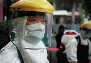 Medical staff stage an anti-Ebola drill at the hospital for tropical diseases in Hanoi on Friday. AFP PHOTO