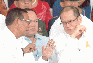 AFP ANNIVERSARY Vice President Jejomar Binay talks to President Benigno Aquino 3rd during the Armed Forces of the Philippines’ 79th anniversary celebration in Camp Aguinaldo in Quezon City on Thursday. PHOTO BY MIGUEL DE GUZMAN