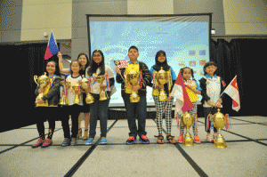 Winning young artists (from left) Pang Emma Evelyn (Malaysia); Dominique Kiersten Lim (Philippines); Angelica Aceron (Philippines); Kelvin Sum Kiok Siong (Malaysia); Aulia Syafitri (Indonesia); Jasmin Chong Sheng Tyen (Malaysia); Emily Yeo (Singapore), with Yenny Saw, country manager of Global Art Philippines (back row)