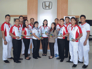 The Honda Cars Makati team showing off their awards