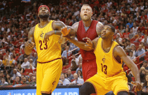 LeBron James No.23 and Tristan Thompson No.13 of the Cleveland Cavaliers box out Chris Andersen No.11 of the Miami Heat during a game at American Airlines Arena on Friday in Miami, Florida. AFP PHOTO