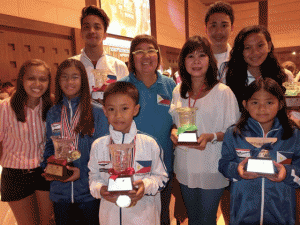 Philippine Swimming League President Susan Papa and Secterary General Maria Susan Benasa with the Most Outstanding Swimmer awardees in the 2014 Royal Bangkok Swimming Championship. CONTRIBUTED PHOTO