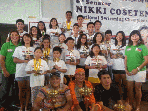 ELITE SWIMMERS  Philippine Swimming League (PSL) President Susan Papa and Secretary General Maria Susan Benasa pose with the Most Outstanding Swimmer awardees in Class A-B and the team champion coaches. CONTRIBUTED BY JOAN MOJDEH