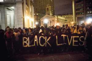 SHOW OF SOLIDARITY  People gather outside the New York Police Department Headquarters after marching in the National March Against Police Violence, which was organized by National Action Network, on Sunday in New York City. The march coincided with a march in Washington D.C. and comes on the heels of two grand jury decisions not to indict white police officers in the deaths of two unarmed black men. AFP PHOTO