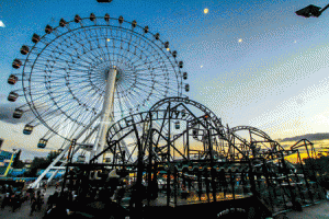 Star City’s ferris wheel dots the Manila Bay landscape with multicolored kaleidoscopic lights