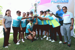 Members of Team South, led by skipper Sylvia Torres (fifth from right), hoist their huge trophy as they celebrate their back-to-back victory over the North squad in the ICTSI LPGT Duel 2 at South Links Golf Club. With them are ICTSI Public Relations head Narlene Soriano (left) and South Links general manager Joe Dagdagan. CONTRIBUTED PHOTO