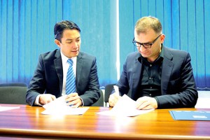 Landmark Pact  Consul Thelmo Cunanan Jr. watches as Dr. Kakha Shengelia signs the Memorandum of Understanding in Tbilisi, Georgia.