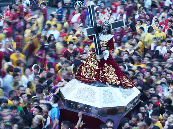  An image of the Black Nazarene is carried around Quiapo church on Thursday, a yearly tradition. The bigger procession will be on the feast of the Black Nazarene on January 9.   Photo by Rene Dilan