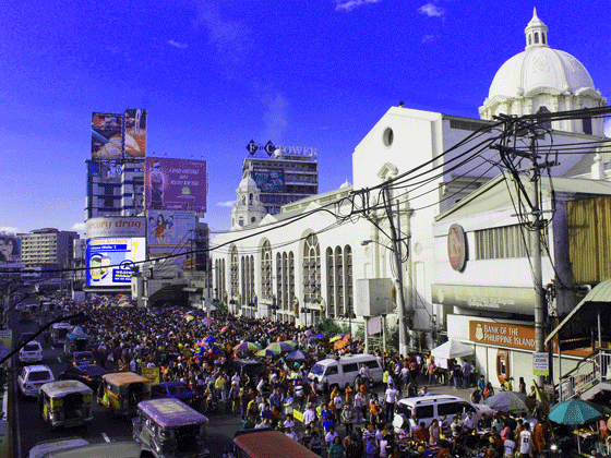  Scores of Black Nazarene devotees spill onto Quezon Ave. while waiting their turn to attend Mass in Quiapo Church on the First Friday of the year. Photo by RUY L. MARTINEZ