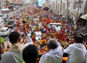 ANNUAL BLESSING  Priests bless images of the Black Nazarene during a procession held at Quezon Blvd. two days before the annual feast of the Nazarene. PHOTO BY RUY MARTINEZ