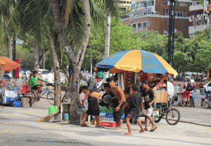 They’re back Street  Children play along Roxas Blvd. in Manila after a brief “vacation” at a resort in Batangas where they were taken during the four-day visit of Pope Francis.  Photo by Ruy L. Martinez