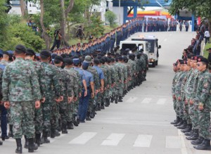 Final send off Members of the Philippine national Police follow a van carrying one of their fallen comrades until the gates of camp bagong diwa. the remains of the commandos have been taken by their families to their hometowns where they will be buried. PhoTo By Ruy L. MARTinez 