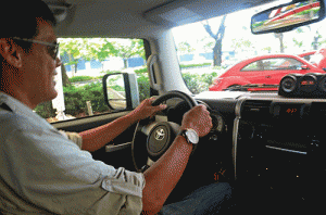 Beeboy holds the steering wheel at the 10 o’clock and 2 o’clock positions.