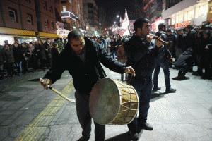 REASON TO REJOICE  Two men surrounded by people play music as they gather to celebrate in Ankara, Turkey on Wednesday after Kurdish forces retook the Syrian border town of Ain al-Arab, known as Kobane. Jubilant residents began trickling back to Kobane after Kurdish fighters drove the Islamic State group from the town, which became a major symbol of resistance against the jihadists. AFP PHOTO