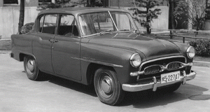 The 1955 Toyopet Crown on the left and the 60th Anniversary Toyota Crown on the right