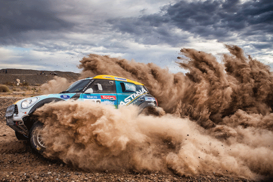 A MINI ALL4 car kicks up some dust during the Dakar Rally