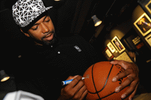 Three-time NBA All-Star player and 2004 NBA Champion Detroit Pistons member Richard “Rip” Hamilton signs balls for fans who visited the first NBA Store in the Philippines