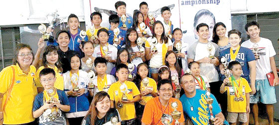 MOST OUTSTANDING SWIMMERS Philippine Swimming League President Susan Papa, Secretary General Maria Susan Benasa, award presenter Maricris Aldanese, team champion coaches Edwin Valdez, Jeffrey Medrano and Rochelle Dimalanta with the Most Outstanding Swimmer awardees.  CONTRIBUTED PHOTO