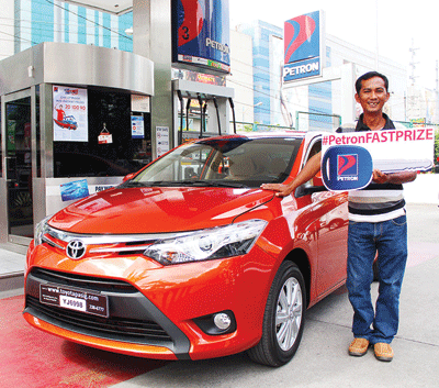Petron Fast Prize winner Ferdinand Siobal receives his brand new Toyota Vios