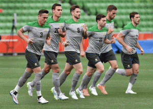 Australian football players jog during their final training session ahead of the Asian Cup in Melbourne on Thursday. Australia and Kuwait play the opening match of the AFC Asian Cup on January 9. AFP PHOTO