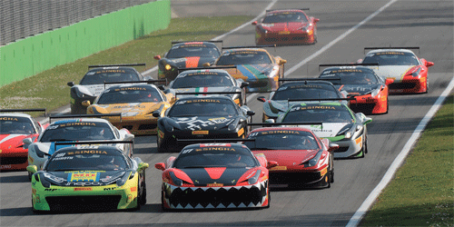 The Ferrari Challenge cars race towards the first corner in one of the Asia- Pacific events