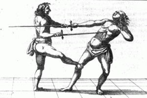 The universality of the concept of using kicks in weapons combat is evident in this illustration from an ancient fencing manual showing the use of a kicking technique in sword fighting. FROM THE BOOK THE MARTIAL ARTS OF RENAISSANCE EUROPE BY DR. SYDNEY ANGLO.