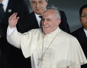 HAPPY LANDING Pope Francis waves to students delivering a performance shortly after arriving at Villamor Airbase. AFP PHOTO