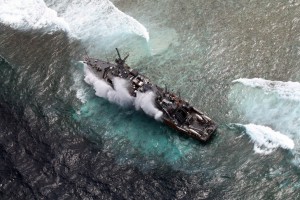 This file handout photo, taken on January 19, 2013 and released on January 20, 2013 by the Philippine Western Command (WESCOM), shows an aerial shot of US Navy minesweeper, the USS Guardian, as it remains trapped on the Tubbataha reef after it ran aground on the western Philippine island of Palawan. AFP PHOTO