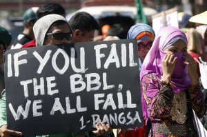 CALL FOR PEACE Members of Muslim groups led by the Mindanao Alliance for Peace hold a rally in front of the House of Representatives in Quezon City to call on lawmakers to pass the proposed Bangsamoro Basic Law.