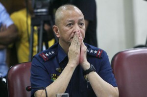 MEN DO CRY  Acting Philippine National Police chief Leonardo Espina fights back tears while delivering his statement at the House of Representatives. PHOTO BY MIGUEL DE GUZMAN 