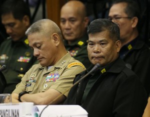 EMOTIONAL GENERAL Major General Edmundo Pangilinan (right), commander of the military’s 6th Infantry Division, is on the verge of tears on Tuesday at a Senate hearing on the Mamasapano clash when the Armed Forces was again blamed for supposedly failing to provide early assistance to police commandos from the Special Action Force. PHOTO BY RENE H. DILAN