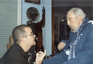 Photo shows student leader Randy Garcia Perdomo peaking with former Cuban president Fidel Castro. AFP PHOTO