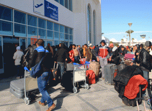 MASS EVACUATION  Egyptians, who were formerly residing in Libya, wait for their departure from Djerba airport on the Tunisian-Libyan border, for a flight evacuating them to Cairo on Tuesday. AFP PHOTO