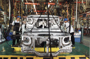 MMPC plant workers assemble body panels of the Mitsubishi Adventure