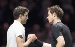 Gilles Simon (left) of France and Britain’s Andy Murray shake hands at the end of their quarter final match of the ABN AMRO World Tennis Tournament in Rotterdam. AFP PHOTO