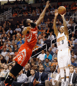 James Harden No.13 of the Houston Rockets reacts after scoring against the Phoenix Suns during the second half of the NBA game at US Airways Center in Phoenix, Arizona. The Rockets defeated the Suns 127-118. AFP PHOTO