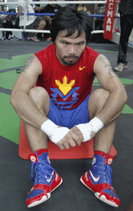 Philippine boxing icon Manny Pacquiao takes a rest during a training session at a gym in General Santos City. AFP PHOTO