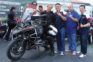 Max Kienle (onboard the BMW motorcycle) together with the Cannonball organizers