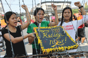 NO SWEET GREETINGS  Members of militant groups hold a mock birthday cake and during a rally at Mendiola on Sunday, President Benigno Aquino 3rd’s 55th birthday. PHOTO BY MELYN ACOSTA